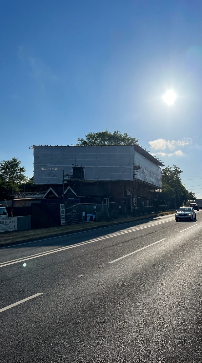 Temporary Roof Scaffolding, Horsham, West Sussex - Armstrong Scaffolding Fully sheeted temporary roof installed by Armstrong Scaffolding over a re-roofing contract in Horsham, West Sussex